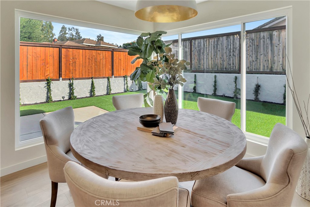 545 North Broadmoor Trail Orange, CA 92869 - Photo 22 of 75 a dining room with furniture and a potted plant