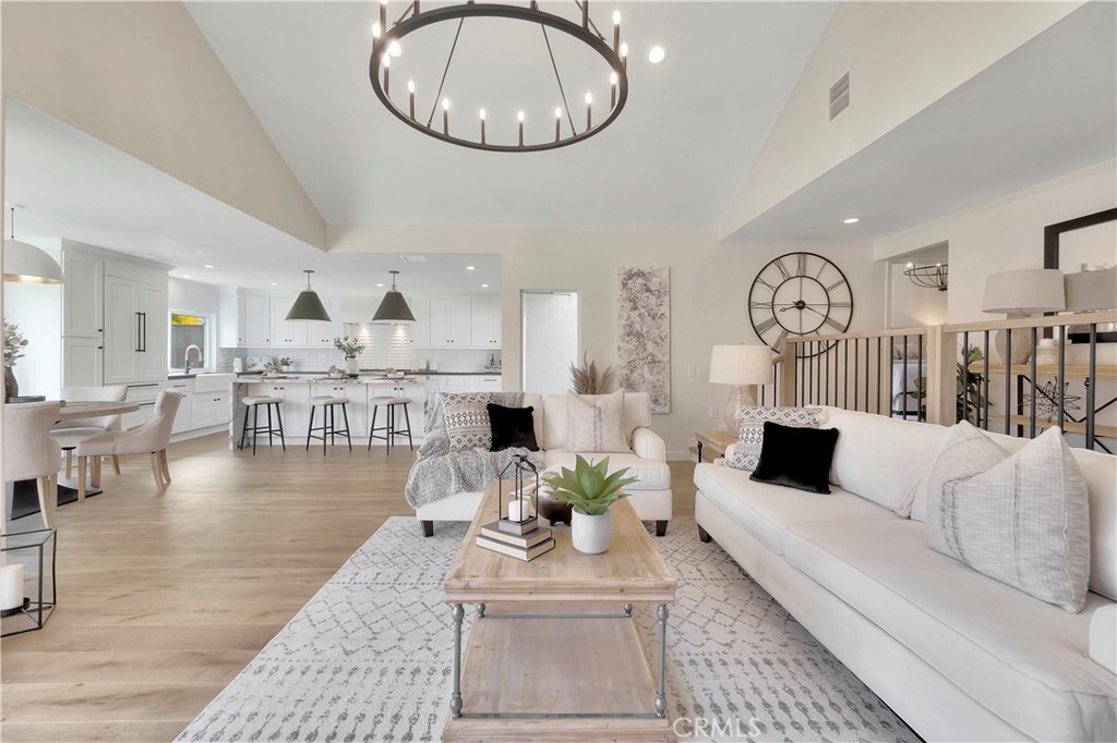 545 North Broadmoor Trail Orange, CA 92869 - Photo 26 of 75 a living room with furniture a clock and a table