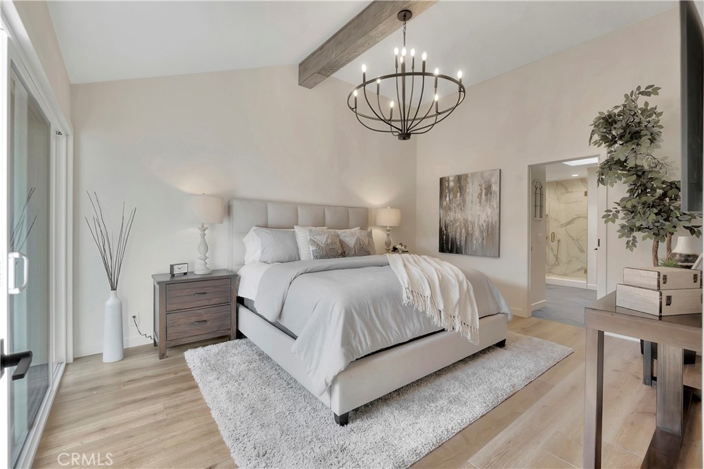 545 North Broadmoor Trail Orange, CA 92869 - Photo 33 of 75 a bedroom with a bed and a chandelier