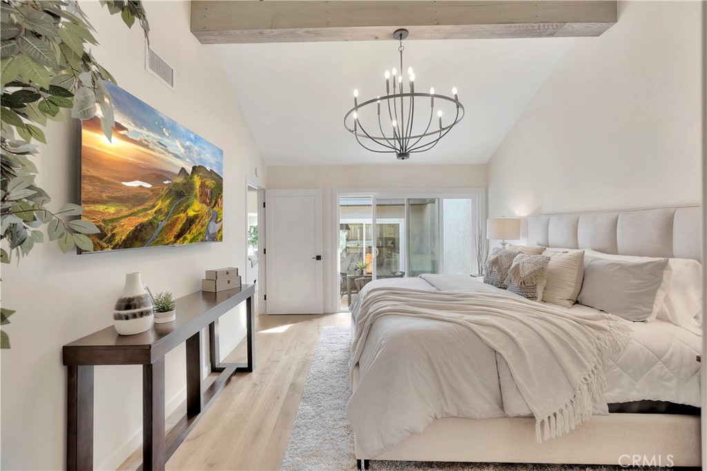 545 North Broadmoor Trail Orange, CA 92869 - Photo 36 of 75 a bedroom with bed and flat screen tv