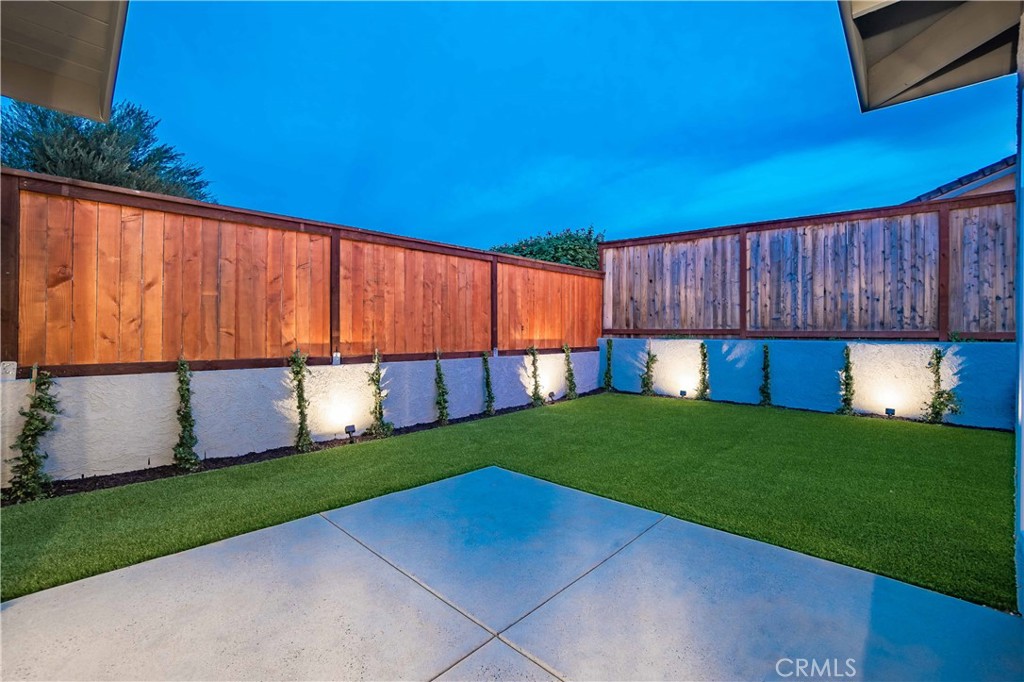 545 North Broadmoor Trail Orange, CA 92869 - Photo 61 of 75 a backyard of a house with lots of green space and wooden fence