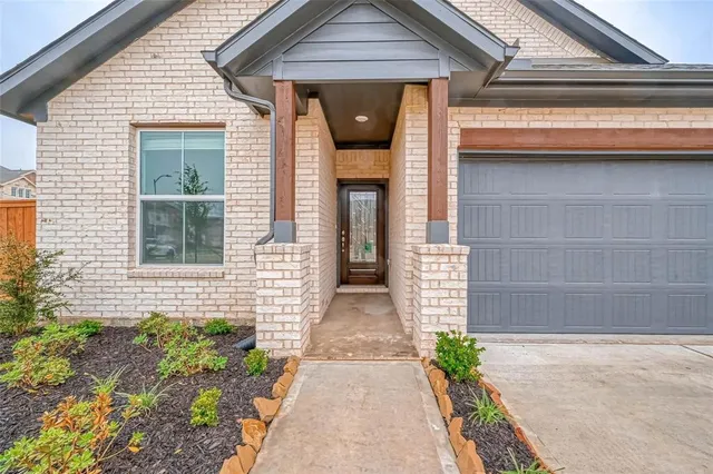 a front view of a house with a porch