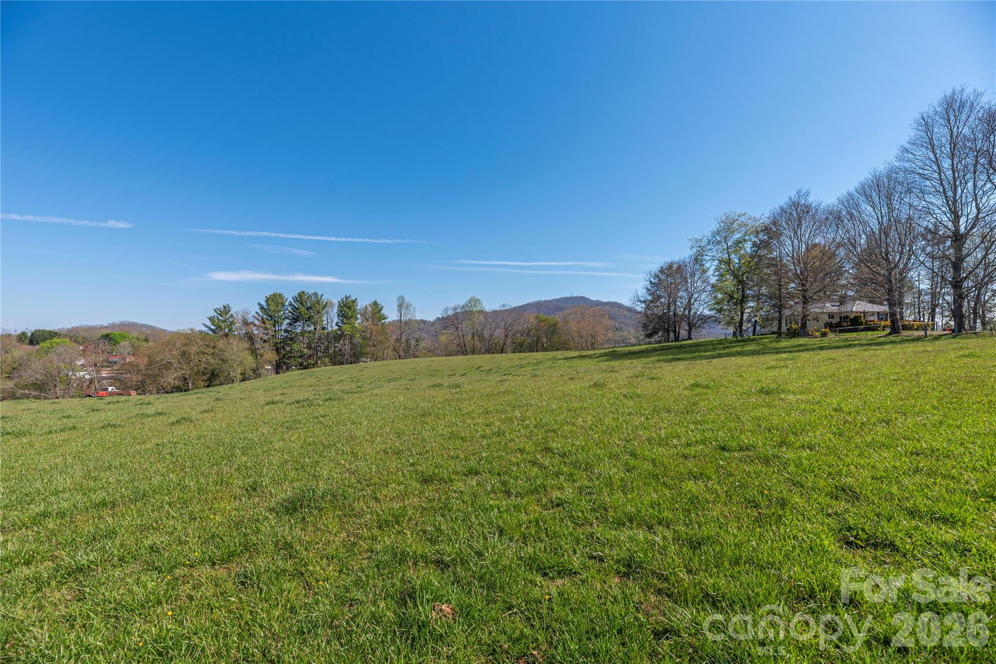 284 Woodland Church Road Clyde, NC 28721 - Photo 18 of 25 a view of a field with an ocean
