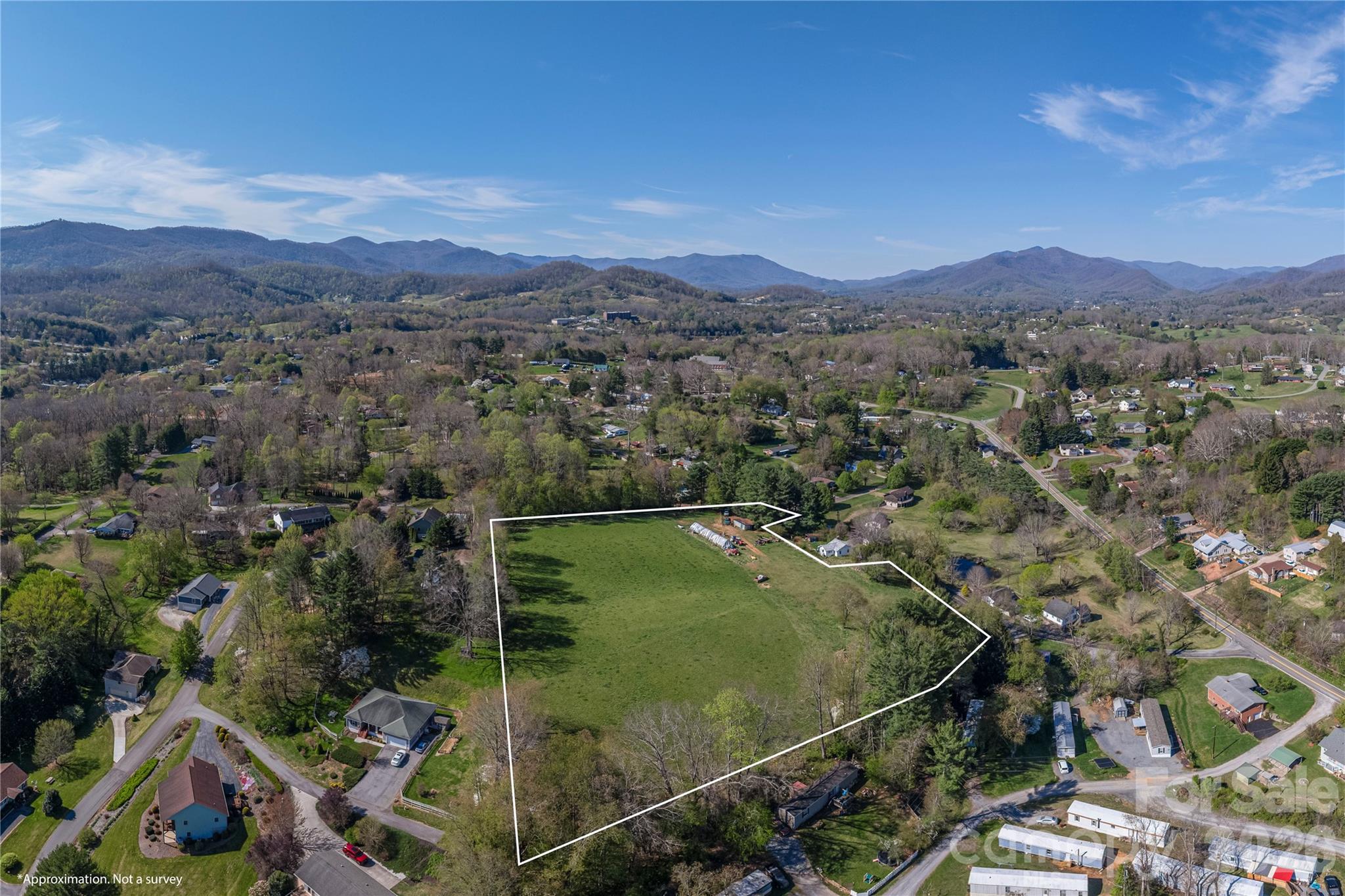 284 Woodland Church Road Clyde, NC 28721 - Photo 24 of 25 an aerial view of residential houses and outdoor space