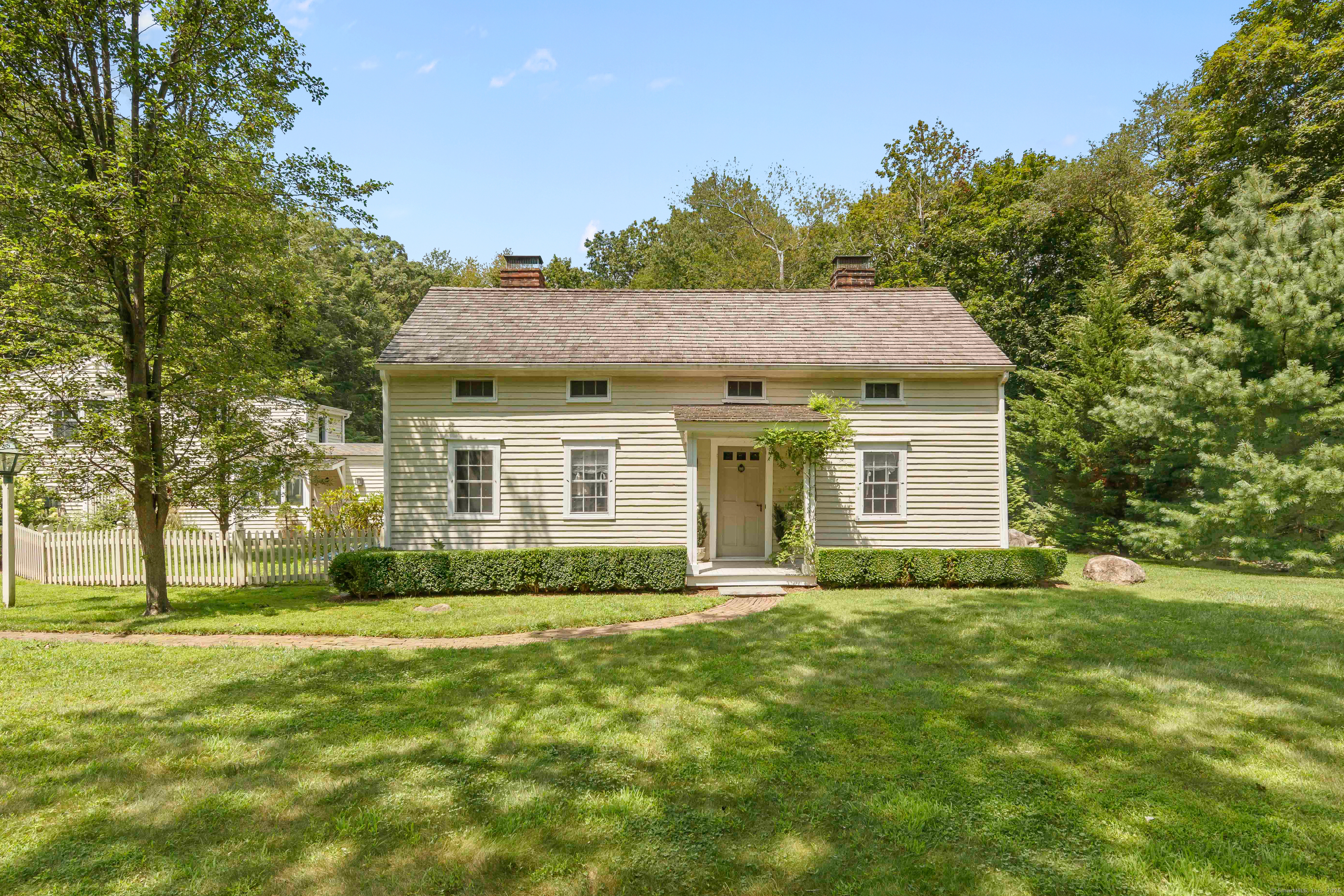 115 Maywood Road Norwalk, CT 06850 - Photo 1 of 1 a front view of a house with a garden