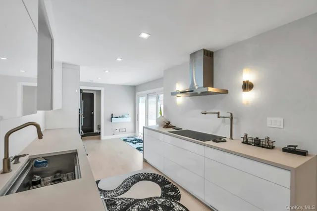a kitchen with sink refrigerator and stove
