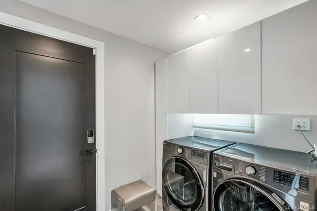 a utility room with dryer and washer