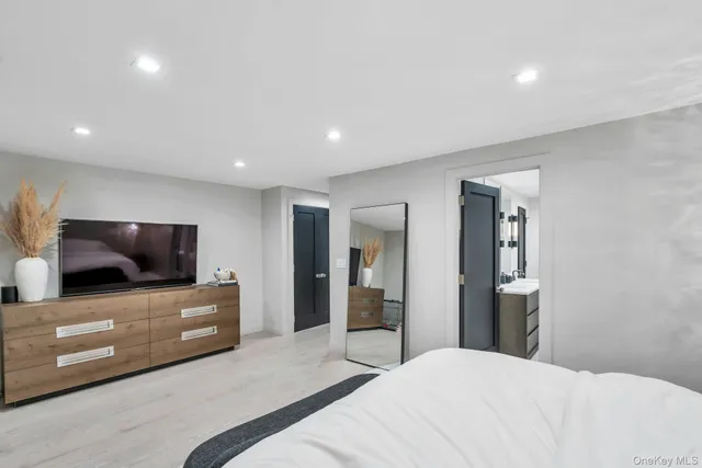 a bedroom with a bed and a television in it