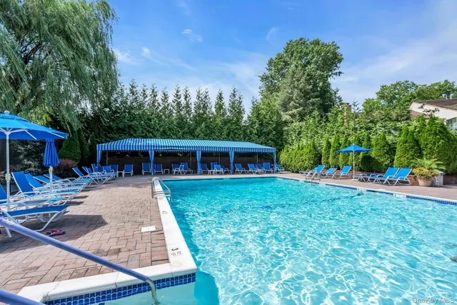 a view of a house with backyard sitting area and garden
