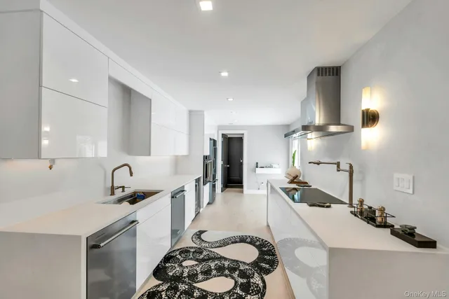 a kitchen with a sink stove and refrigerator