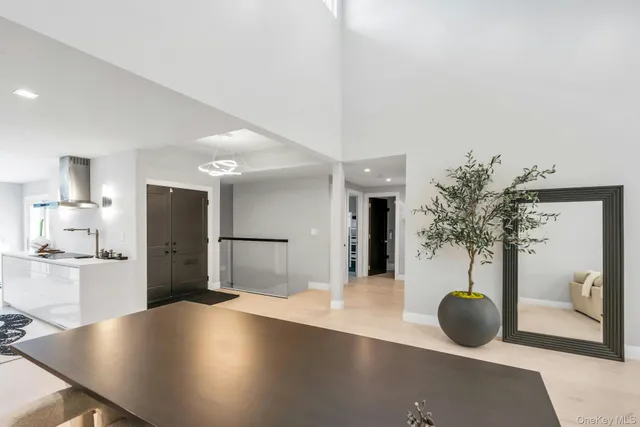 a view of kitchen with furniture and refrigerator