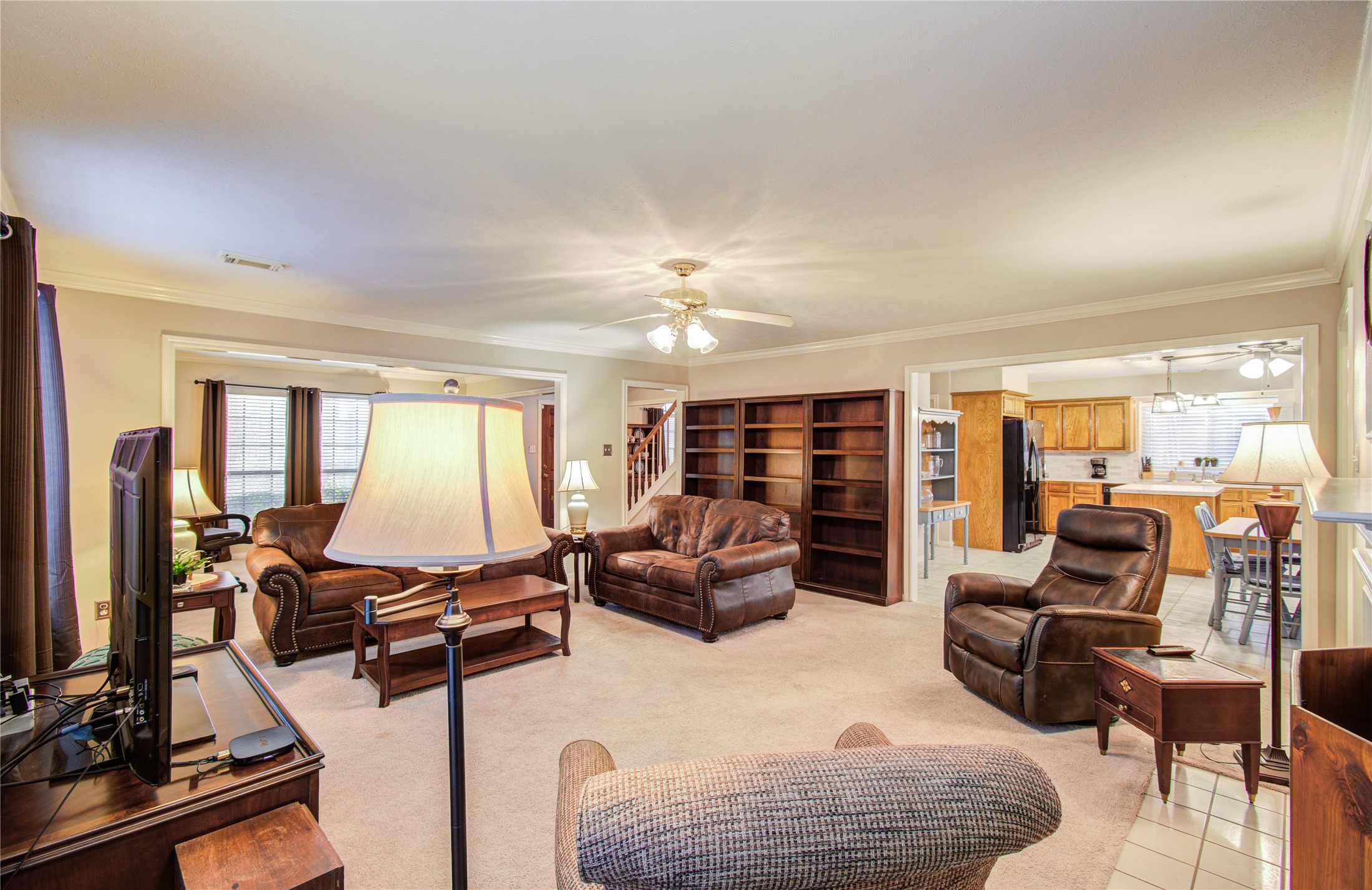 5927 Thom Road Humble, TX 77346 - Photo 24 of 50 The large living area includes built-in shelving and a fireplace, offering both functionality and a cozy ambiance.