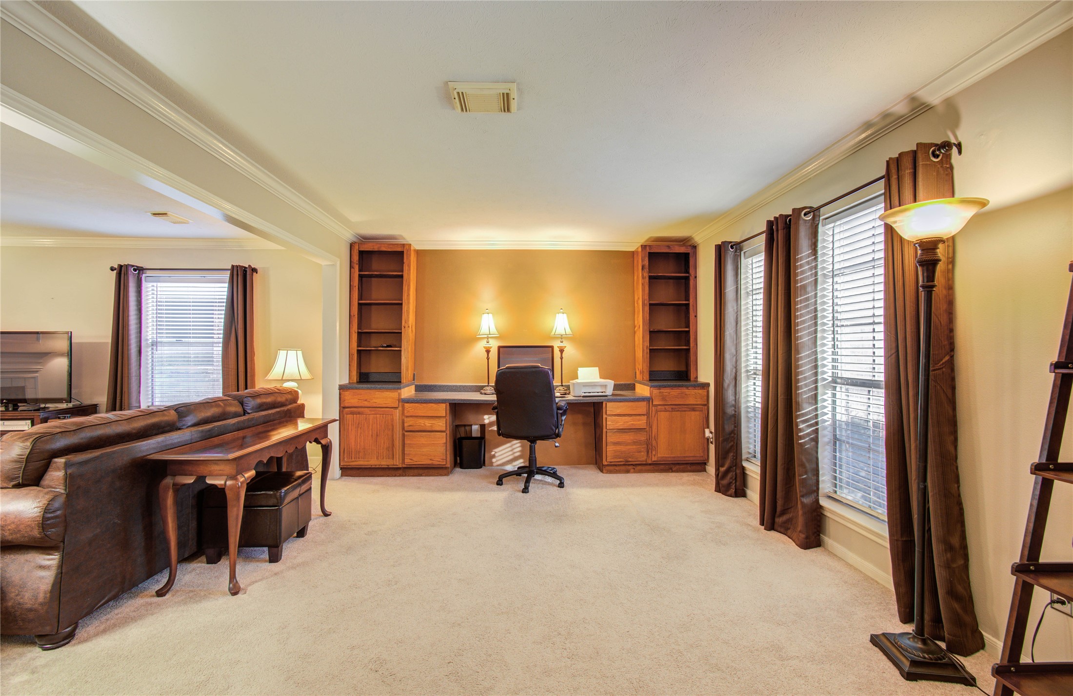 5927 Thom Road Humble, TX 77346 - Photo 27 of 50 The home offers a spacious study featuring built-in shelving, ideal for a home office or flex space.