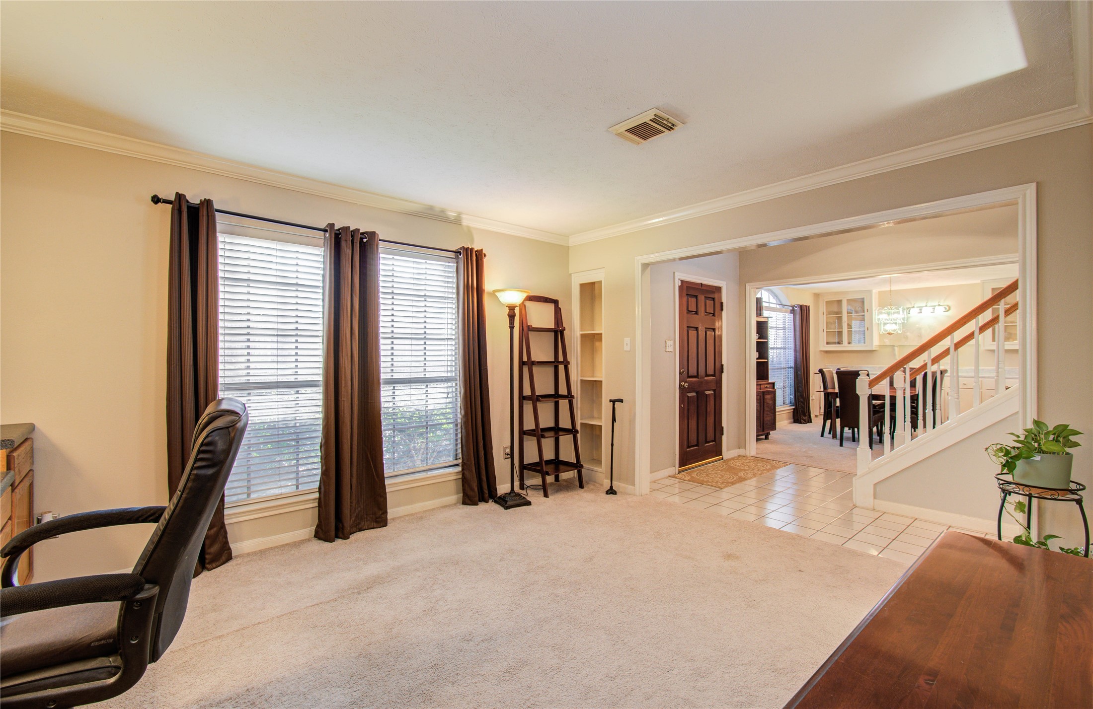 5927 Thom Road Humble, TX 77346 - Photo 29 of 50 The home offers a spacious study featuring built-in shelving, ideal for a home office or flex space.
