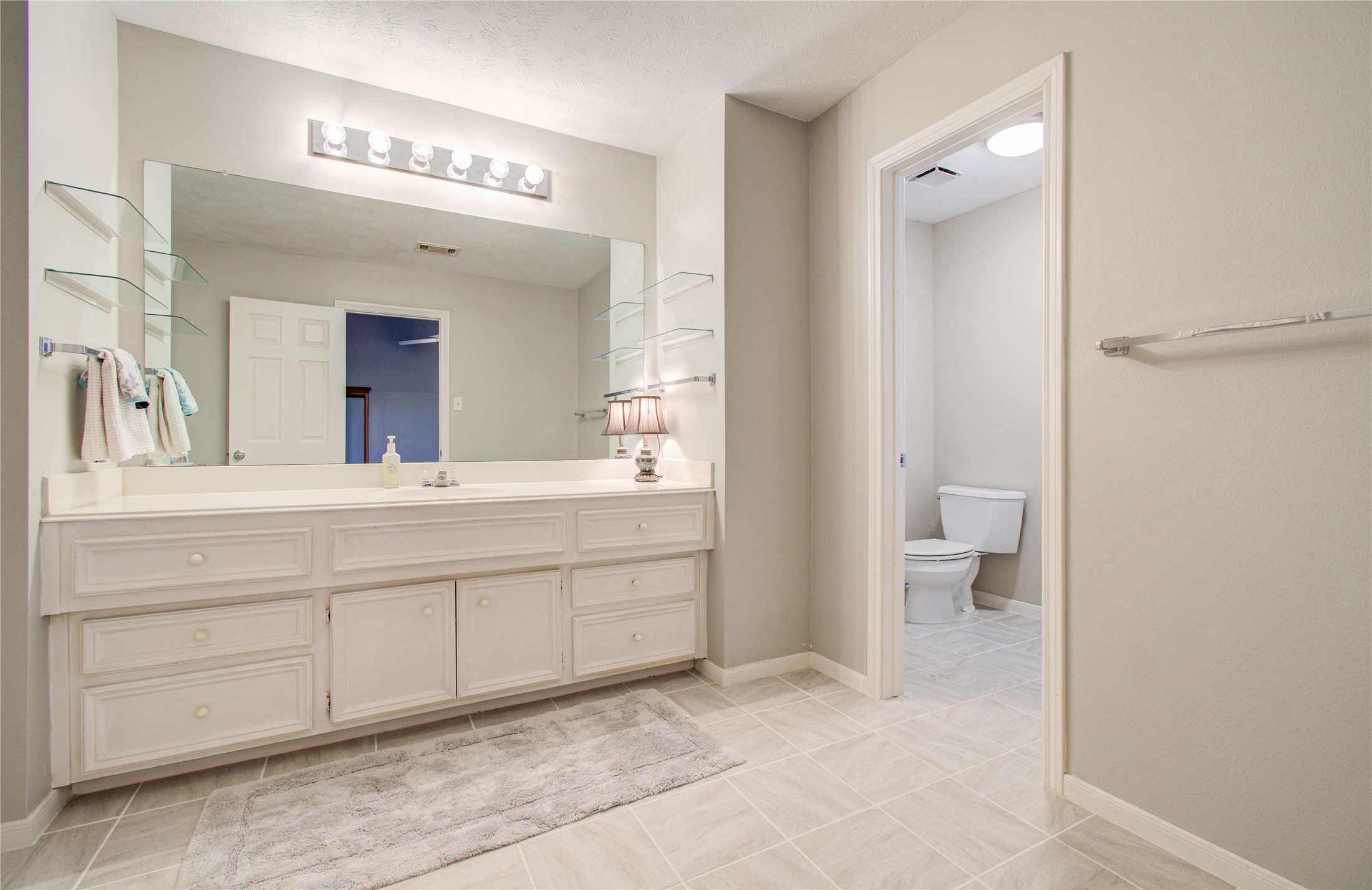 5927 Thom Road Humble, TX 77346 - Photo 32 of 50 A spacious upstairs bathroom includes plenty of cabinet space and a shower/tub combination.