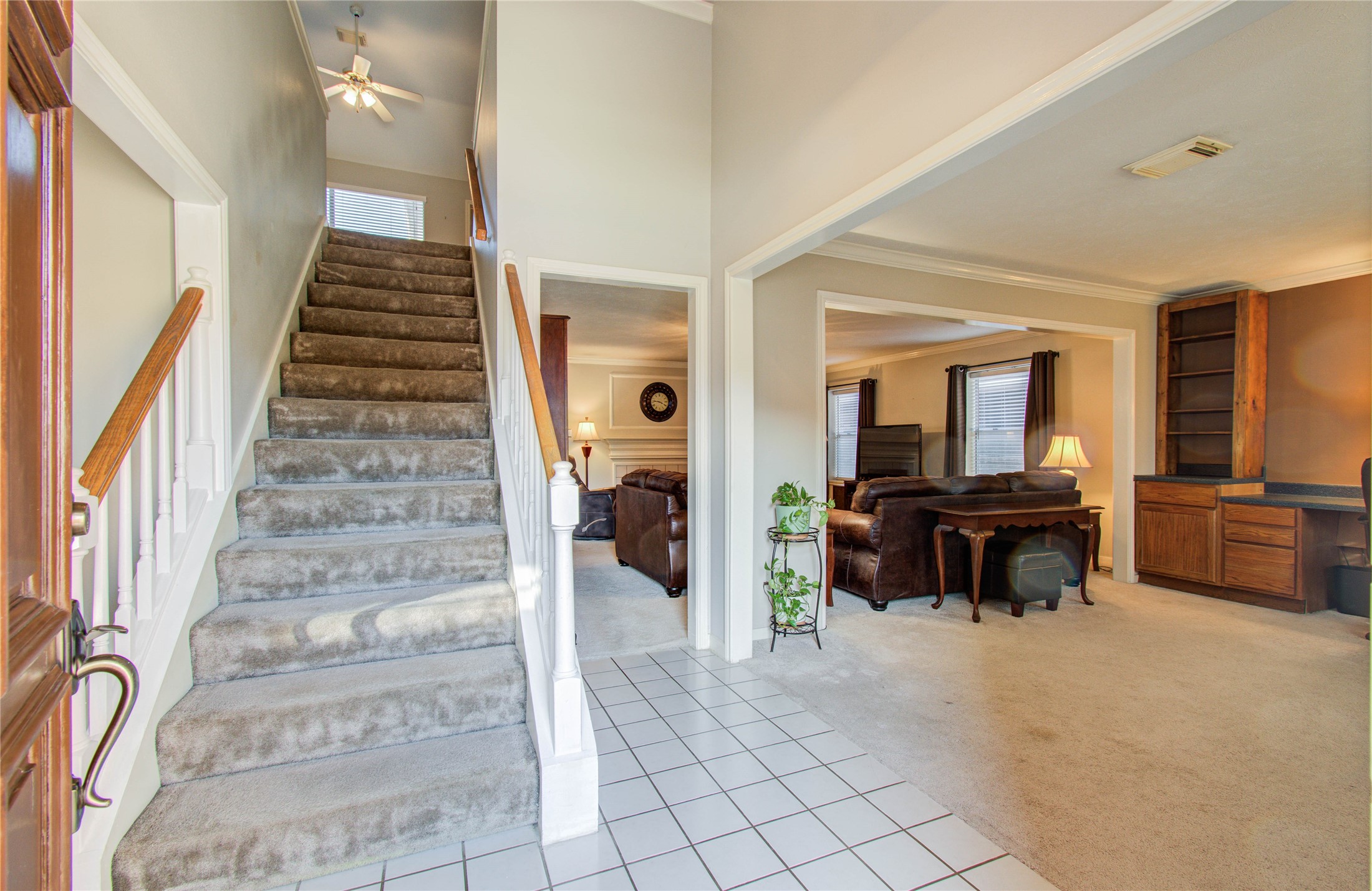 5927 Thom Road Humble, TX 77346 - Photo 4 of 50 Upon entry, you are greeted by views of the private study, family room, and formal dining room, highlighting the home’s open and well-designed layout.