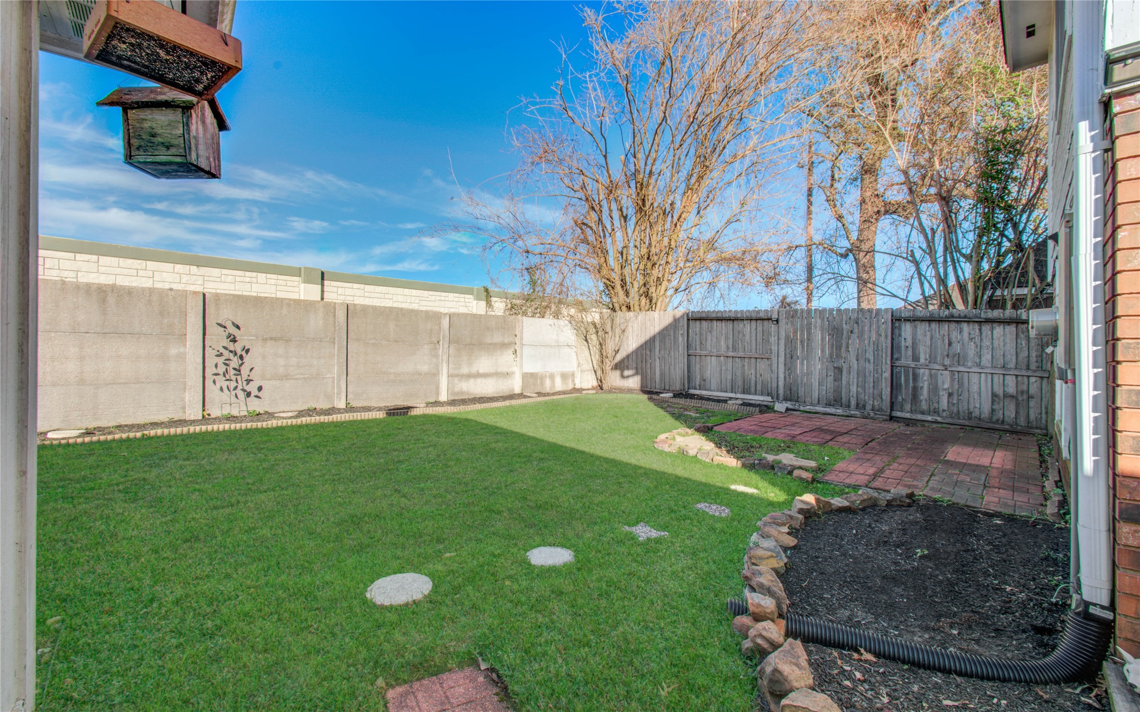 5927 Thom Road Humble, TX 77346 - Photo 48 of 50 Backyard includes flower beds ready for your custom landscaping—perfect for creating your own outdoor oasis.