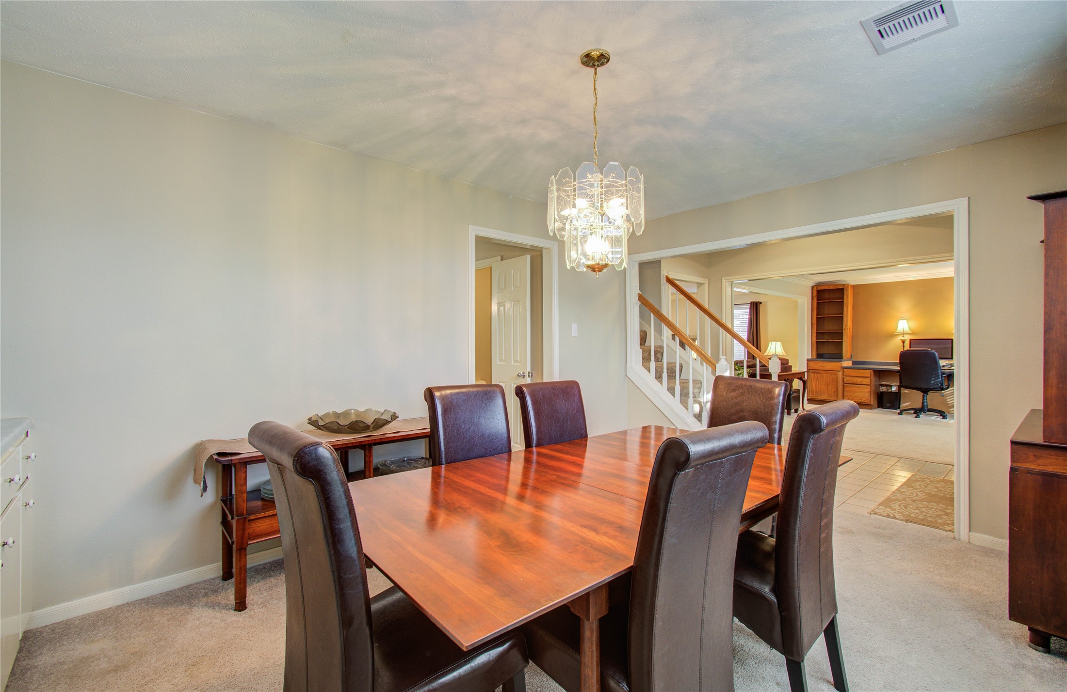 5927 Thom Road Humble, TX 77346 - Photo 5 of 50 The formal dining room offers abundant natural light and custom built-ins, creating an inviting space for gatherings.
