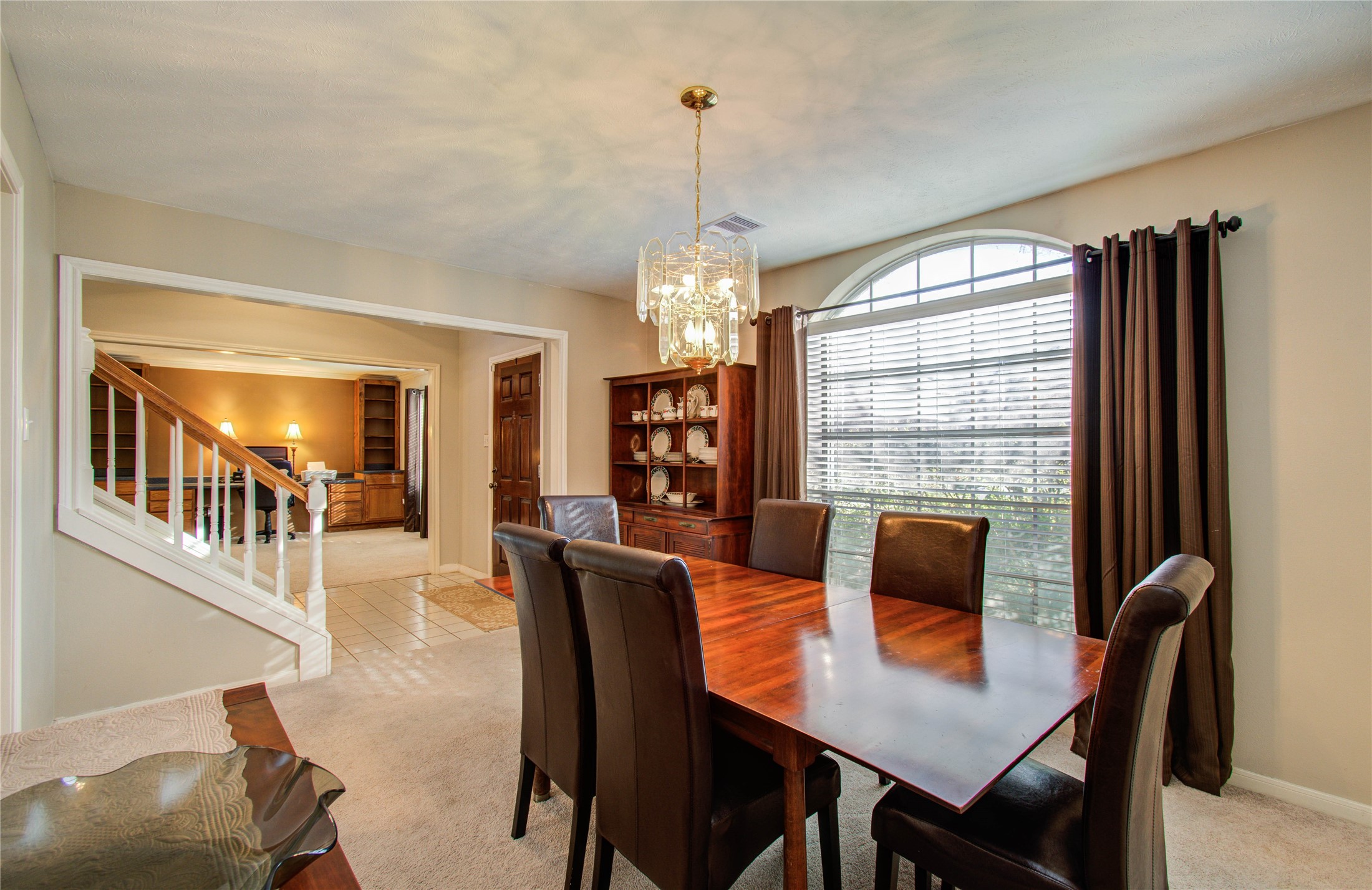 5927 Thom Road Humble, TX 77346 - Photo 6 of 50 The formal dining room offers abundant natural light and custom built-ins, creating an inviting space for gatherings.