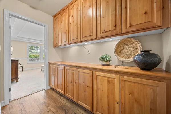 a spacious bedroom with a bed and a chandelier