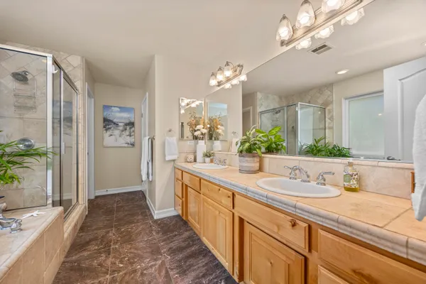 a bathroom with a bathtub and shower