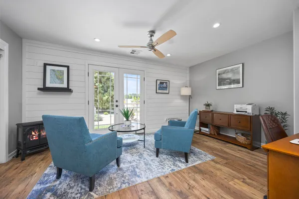a living room with furniture and a large window