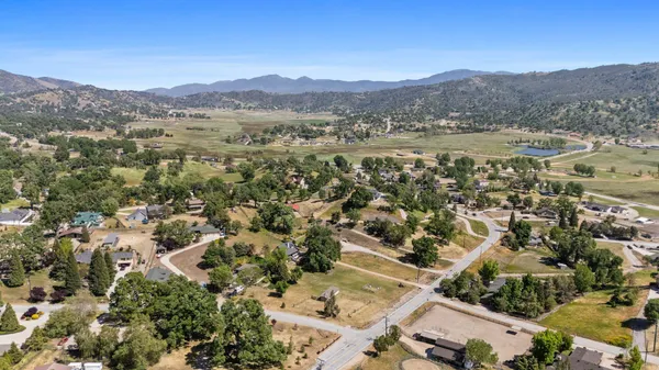 an aerial view of residential house and green space