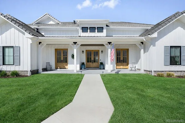 front view of a house with a yard