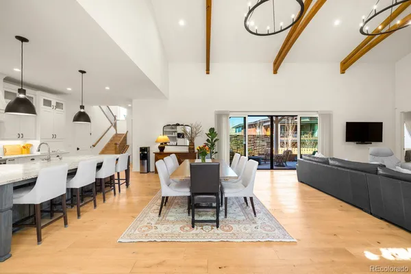 a living room with furniture a rug and a flat screen tv