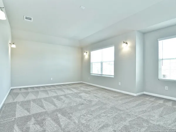a bathroom with a shower and a sink