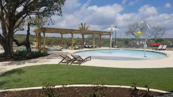 a view of a swimming pool with a backyard