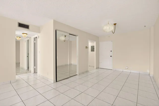 a kitchen with cabinets stainless steel appliances and a counter space