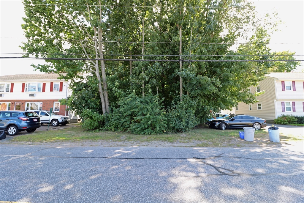 184 Howard Street Ludlow, MA 01056 - Photo 12 of 18 a view of a house with a garden and sitting area