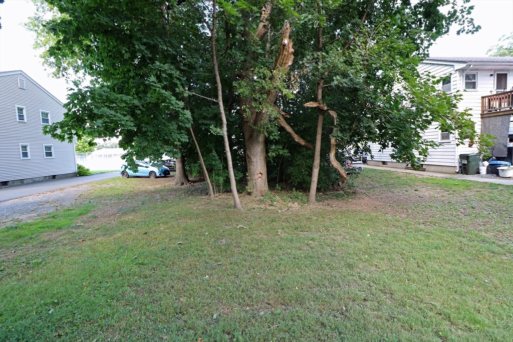 184 Howard Street Ludlow, MA 01056 - Photo 6 of 18 a view of a field with a tree