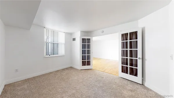 a view of an empty room with a window