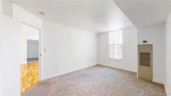 a view of an empty room with a window
