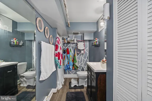 a bathroom with a sink vanity and a mirror