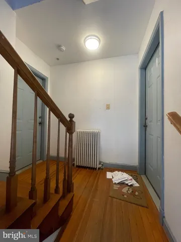 a bath tub sitting next to a white toilet