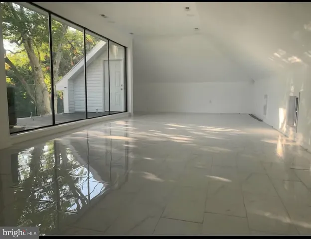 a bathroom with a sink a toilet and a window