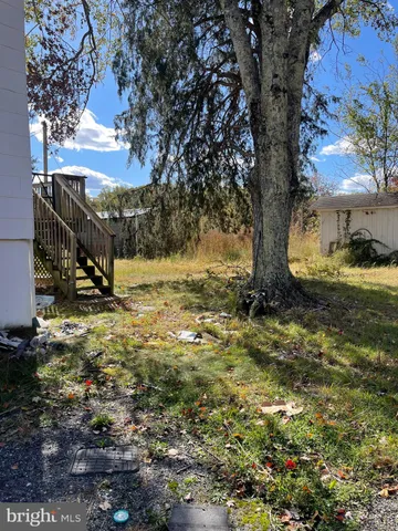 a view of a storage & utility room with two washing machine