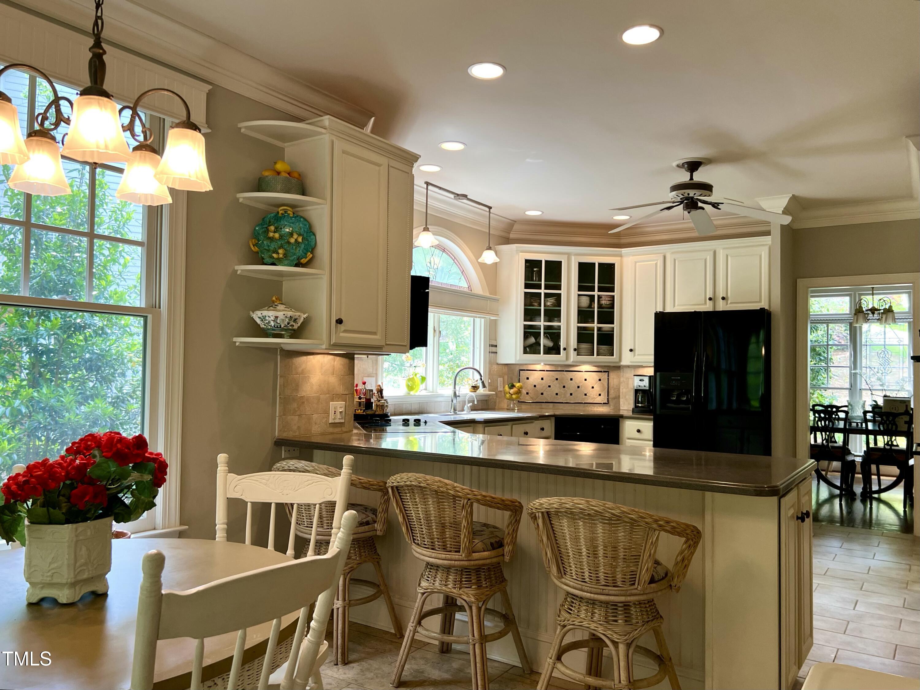 1425 Bascomb Drive Raleigh, NC 27614 - Photo 10 of 51 a kitchen with stainless steel appliances granite countertop a stove and a refrigerator