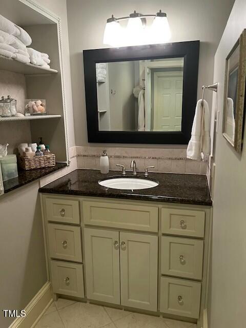 1425 Bascomb Drive Raleigh, NC 27614 - Photo 19 of 51 a bathroom with a sink vanity and a mirror