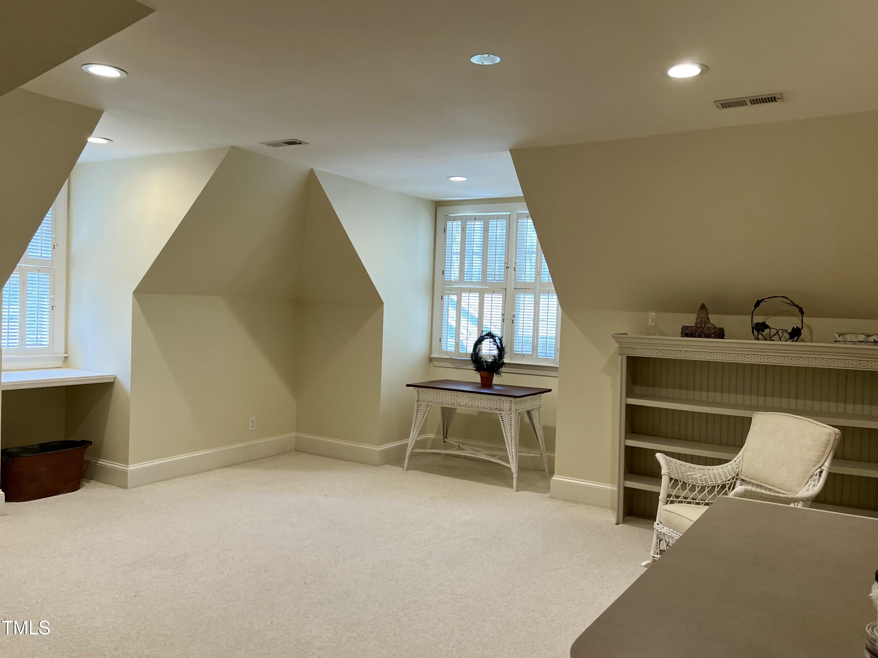1425 Bascomb Drive Raleigh, NC 27614 - Photo 23 of 51 a living room with furniture a rug and white walls