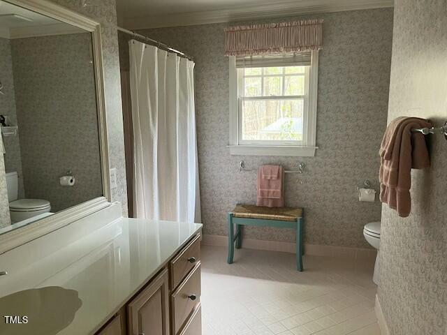 1425 Bascomb Drive Raleigh, NC 27614 - Photo 24 of 51 a bathroom with a sink a toilet and a mirror