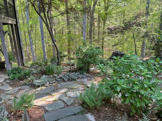 1425 Bascomb Drive Raleigh, NC 27614 - Photo 28 of 51 a view of a garden with plants and trees