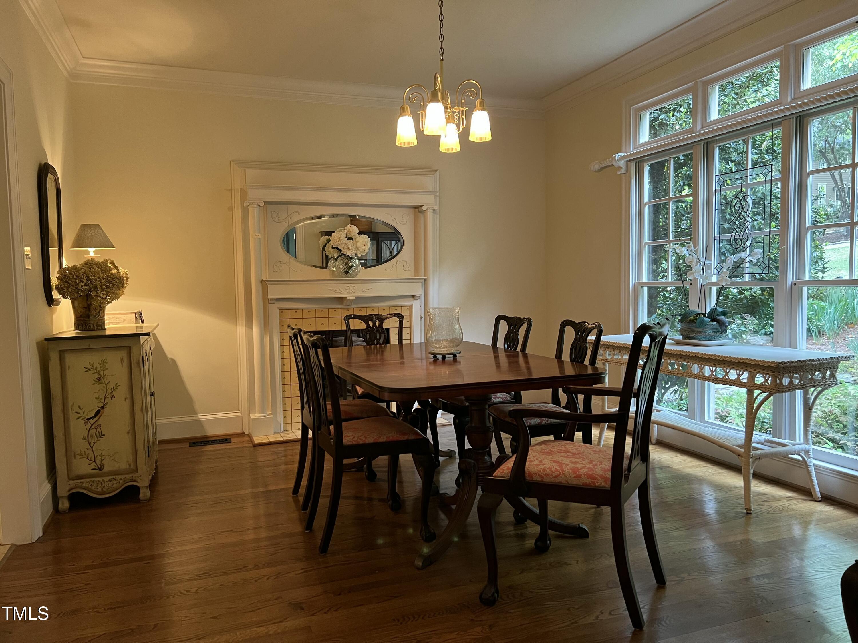 1425 Bascomb Drive Raleigh, NC 27614 - Photo 5 of 51 a view of a dining room with furniture window and wooden floor