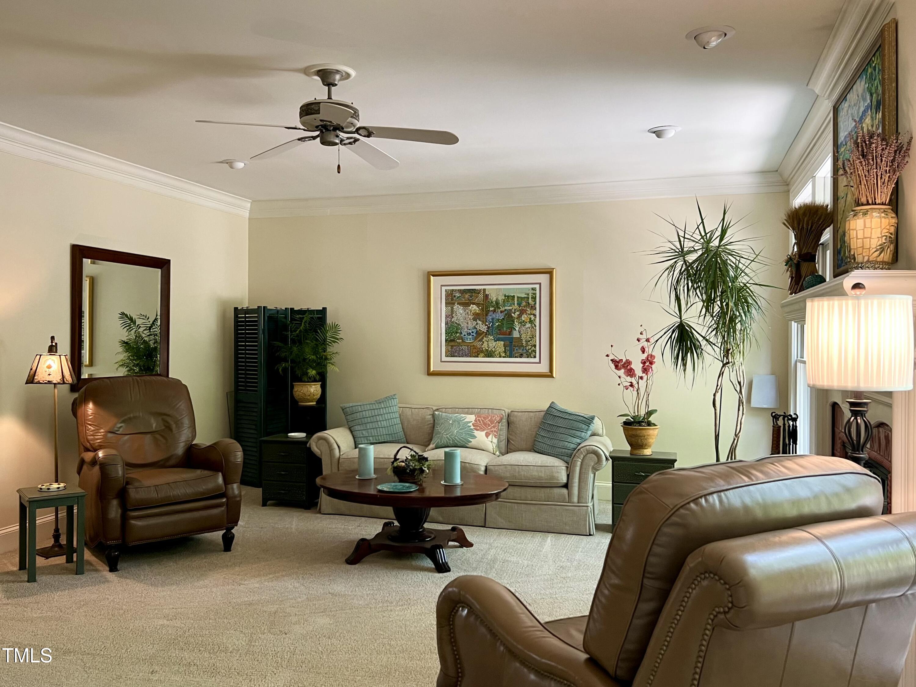 1425 Bascomb Drive Raleigh, NC 27614 - Photo 7 of 51 a living room with furniture and a fireplace