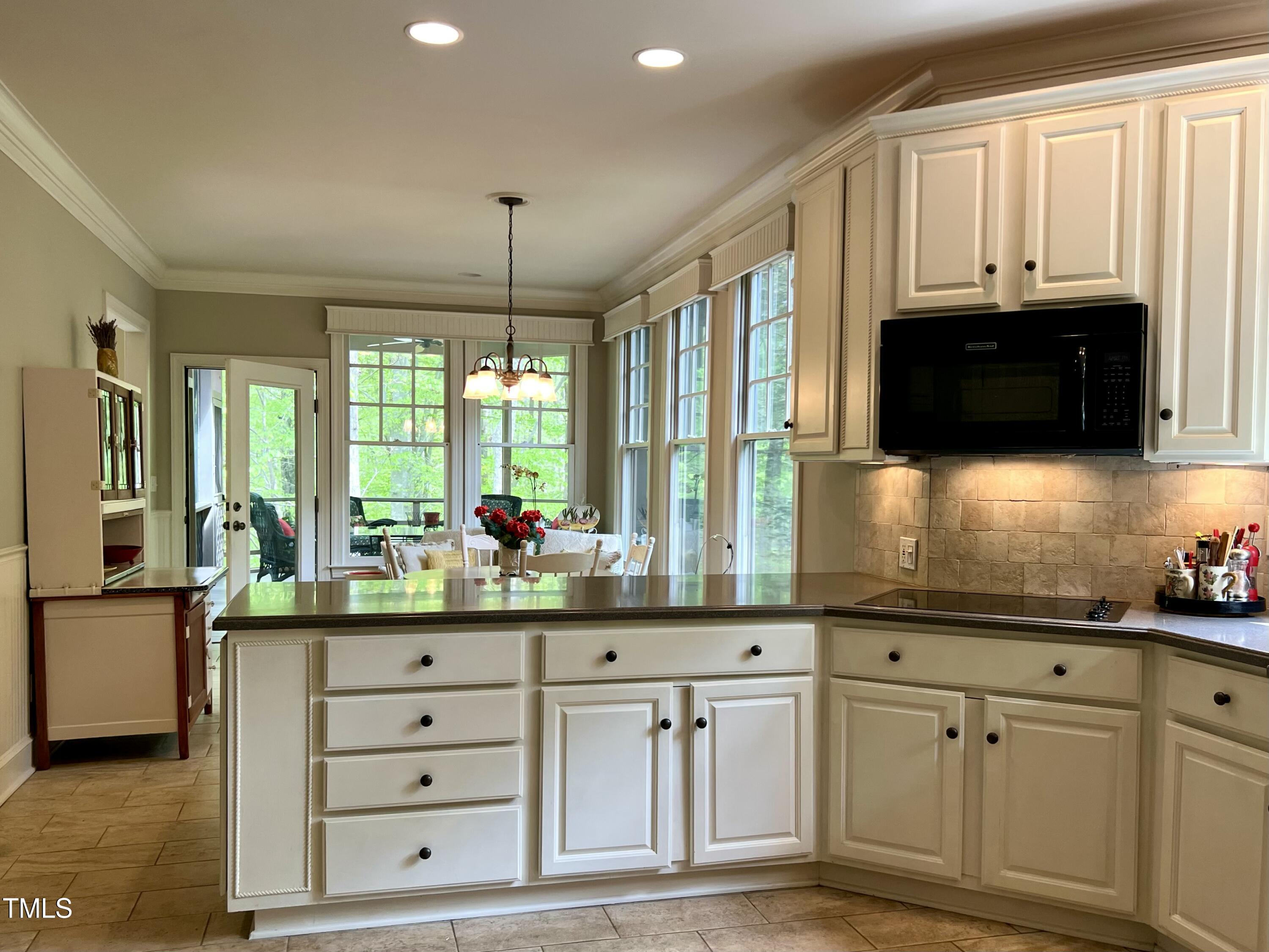 1425 Bascomb Drive Raleigh, NC 27614 - Photo 8 of 51 a kitchen with cabinets appliances and a window