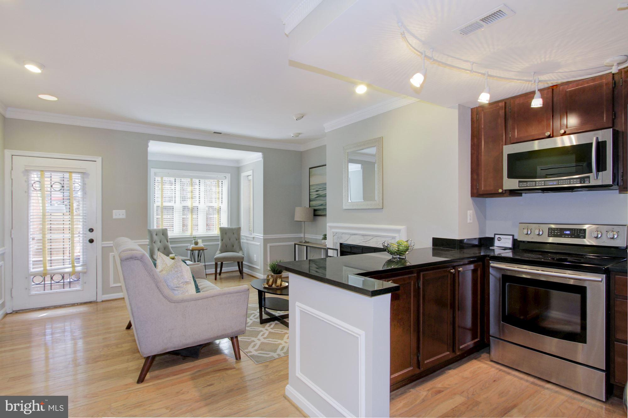 1205 N Street Northwest, Unit A Washington, DC 20005 - Photo 10 of 25 Bright and sunny living are with kitchen island