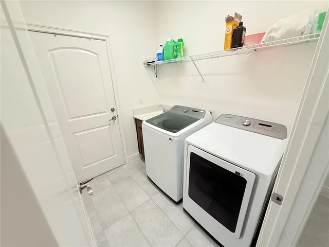 a utility room with dryer and washer